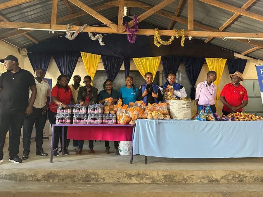 Rotary members gathered around food supplies at Kariobangi North Primary School.